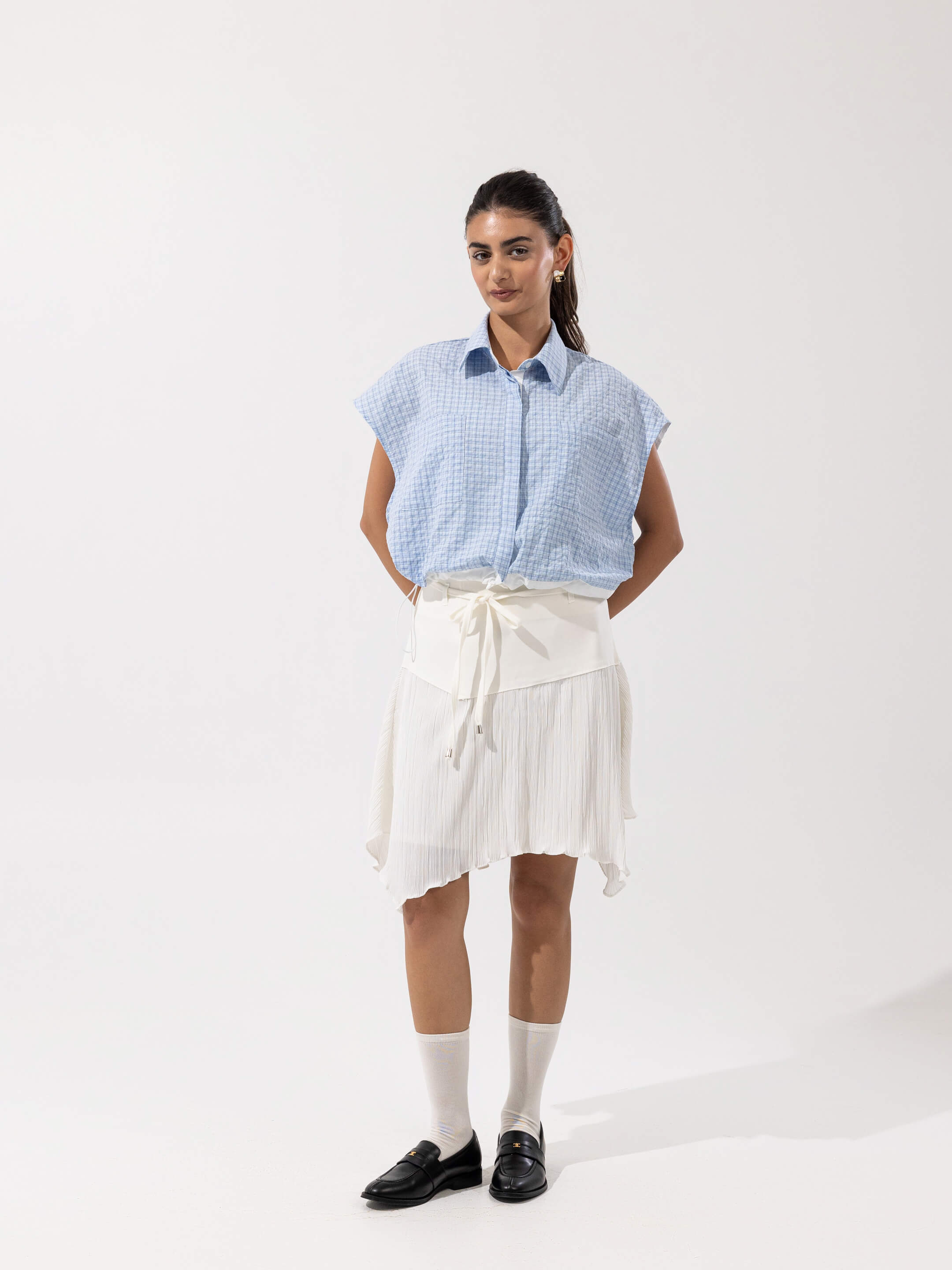 PLEATED ASYMMETRIC SKIRT